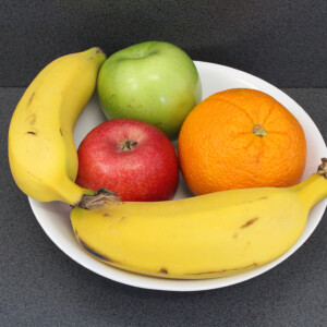 Fruit Bowl close up on grey table.